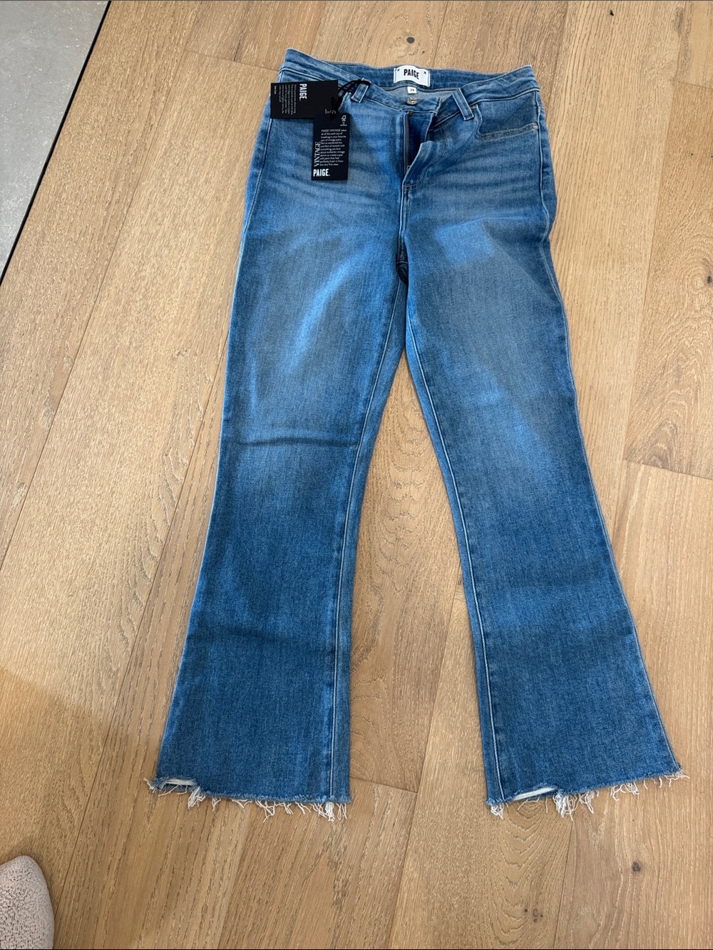 PAIGE Medium Blue High-Rise Flare Jeans with Frayed Hem